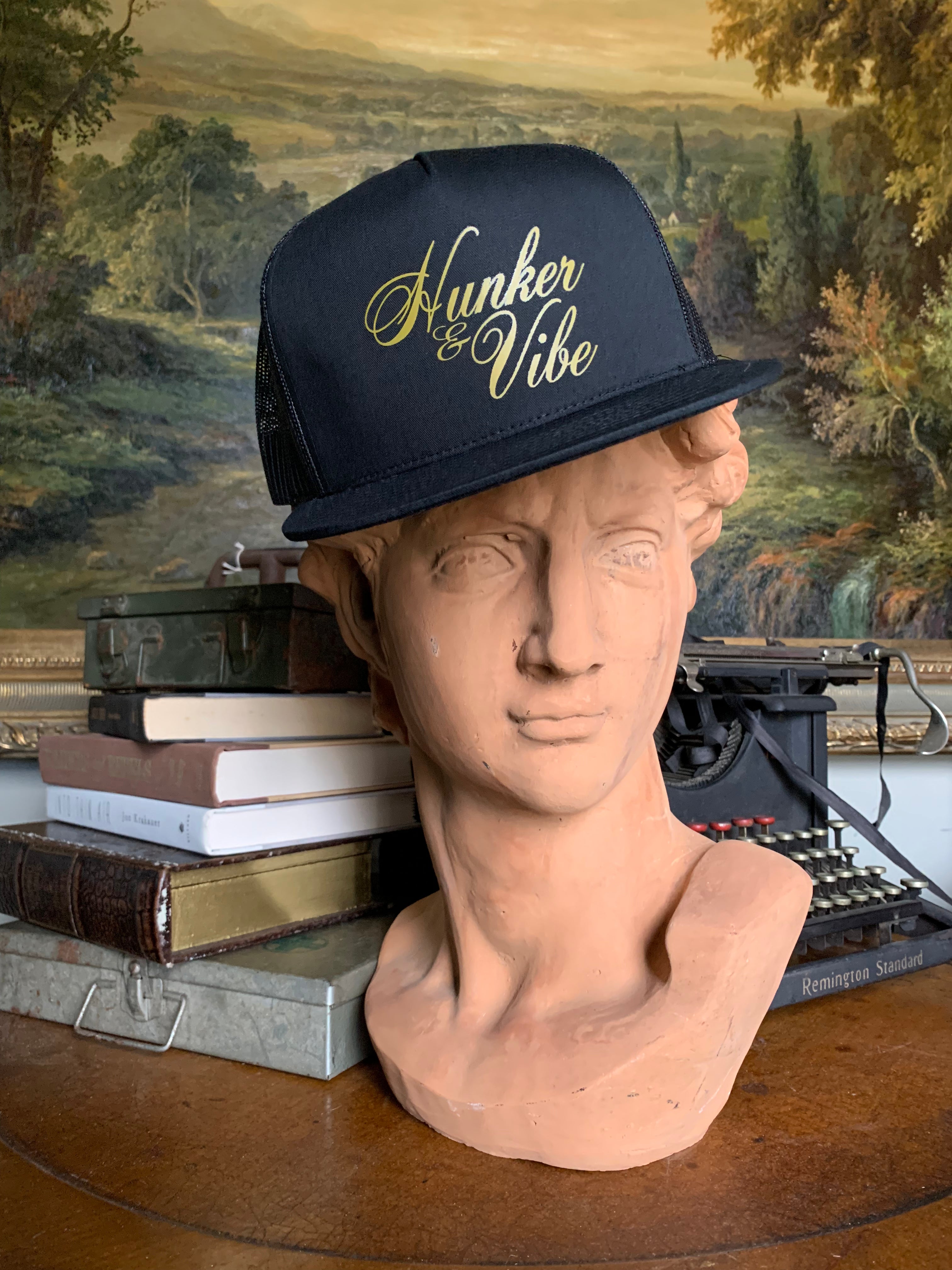 The Black Signarure Hunker & Vibe Trucker Hat
