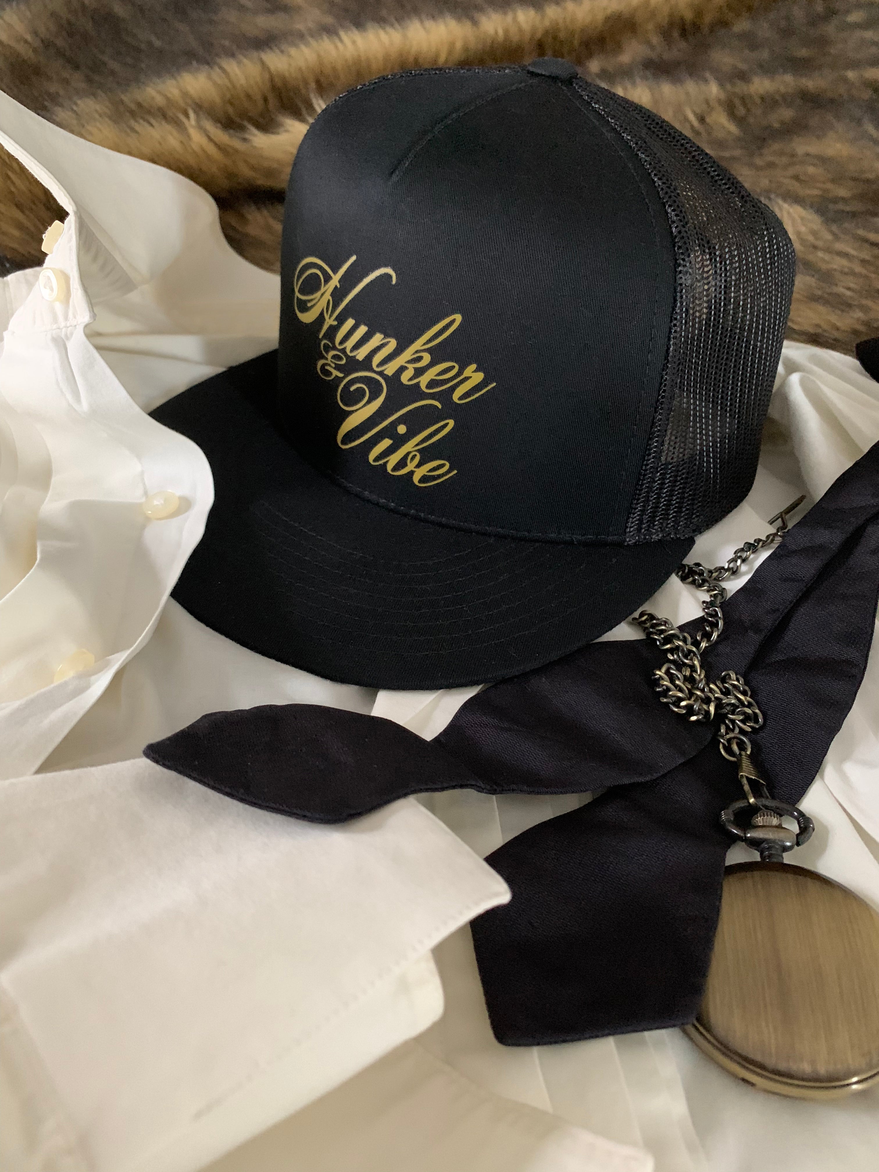 The Black Signarure Hunker & Vibe Trucker Hat